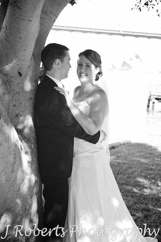Bride laughing in grooms arms - wedding photography sydney